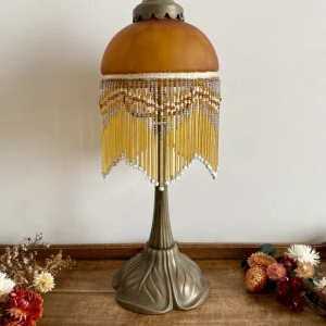 Lampe abat jour rideau style charleston verre orangé